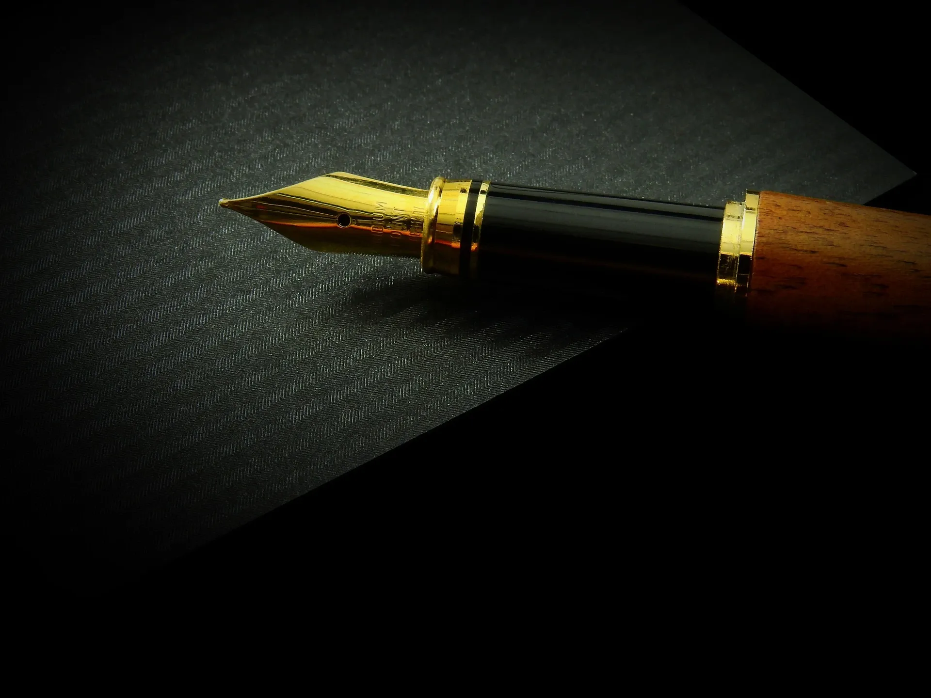 Image of a writer's pen on a black background